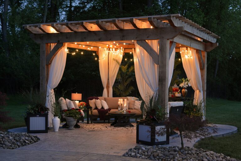 Outdoor patio with comfortable seating and greenery